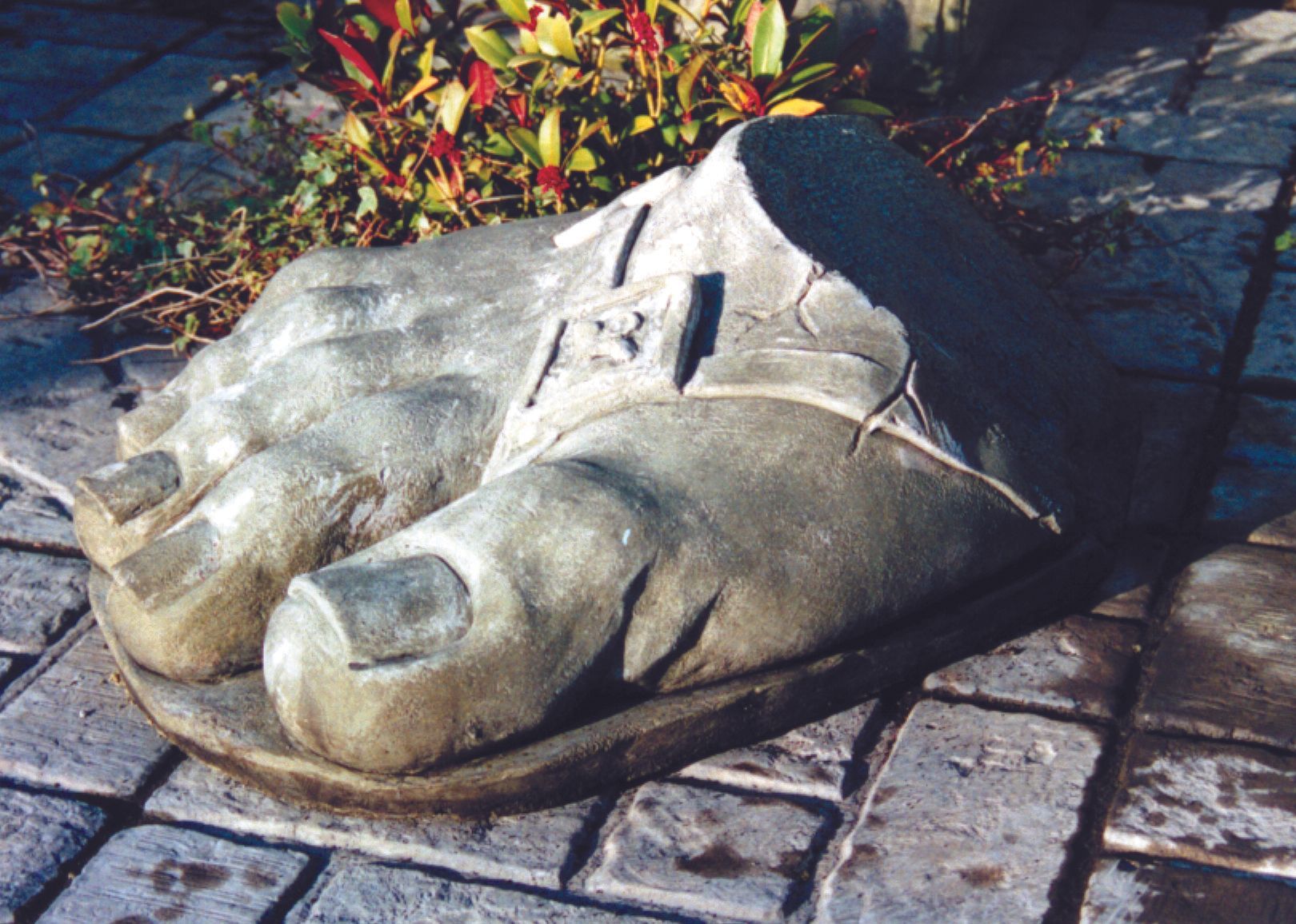 giant foot stone garden statue