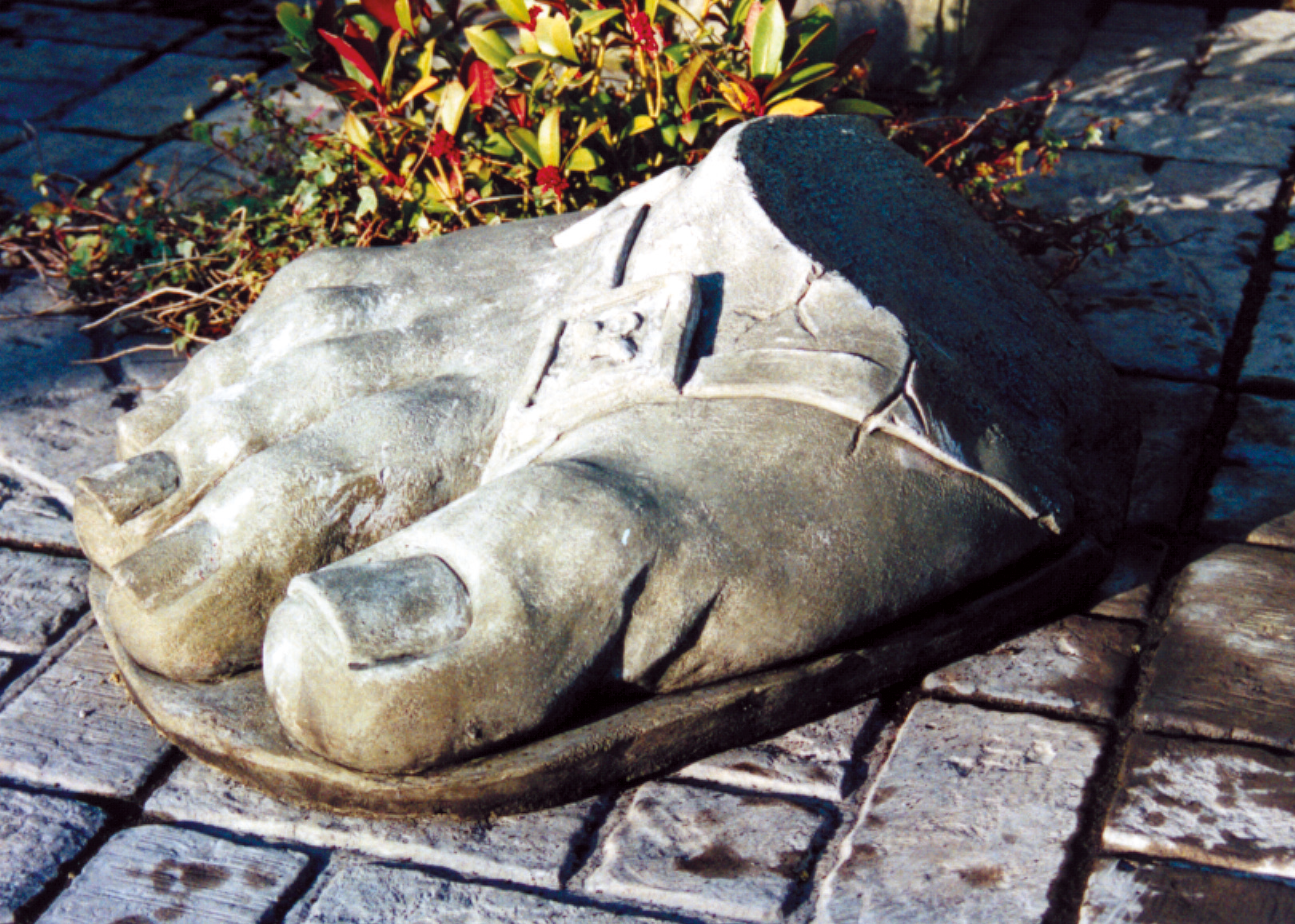 giant foot stone garden statue