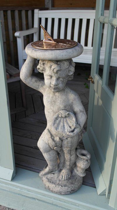 stone garden statue cherub aged brass sundial