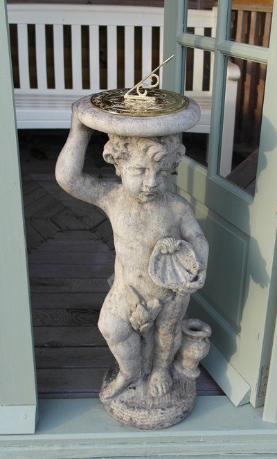 stone garden statue cherub brass sundial