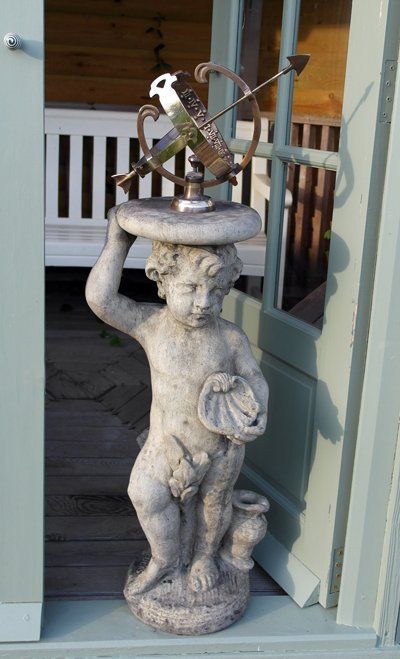 stone garden statue cherub armillary