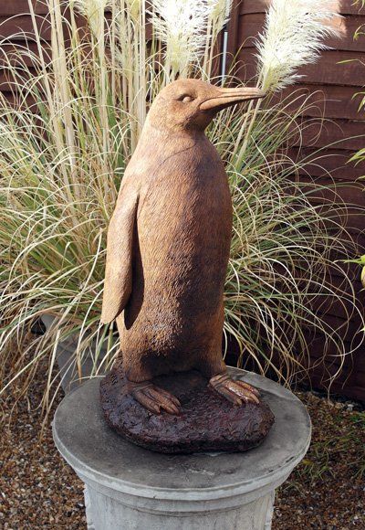 stone garden statue giant penguin