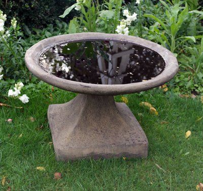 stone garden statue low birdbath