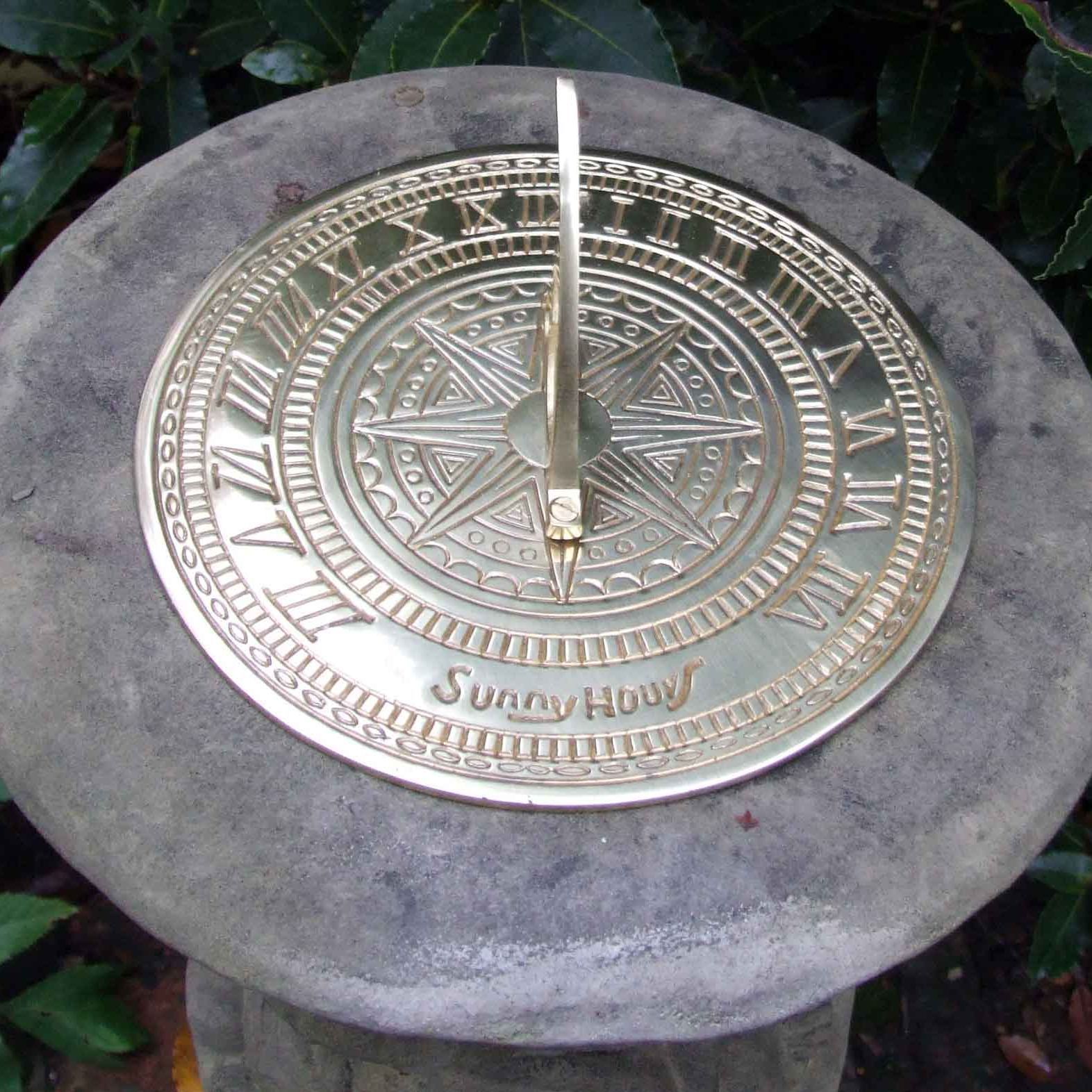 stone garden statue round brass dial sundail