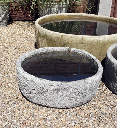 stone garden statue round reservoir