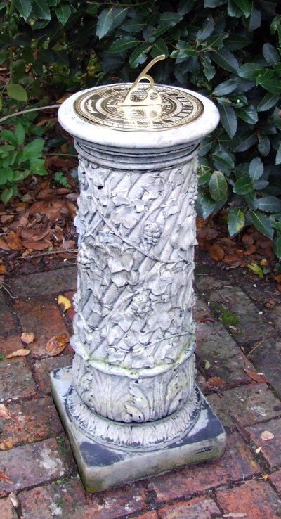 stone garden statue vine brass sundial