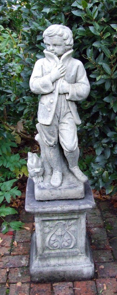 stone garden statue winter boy season