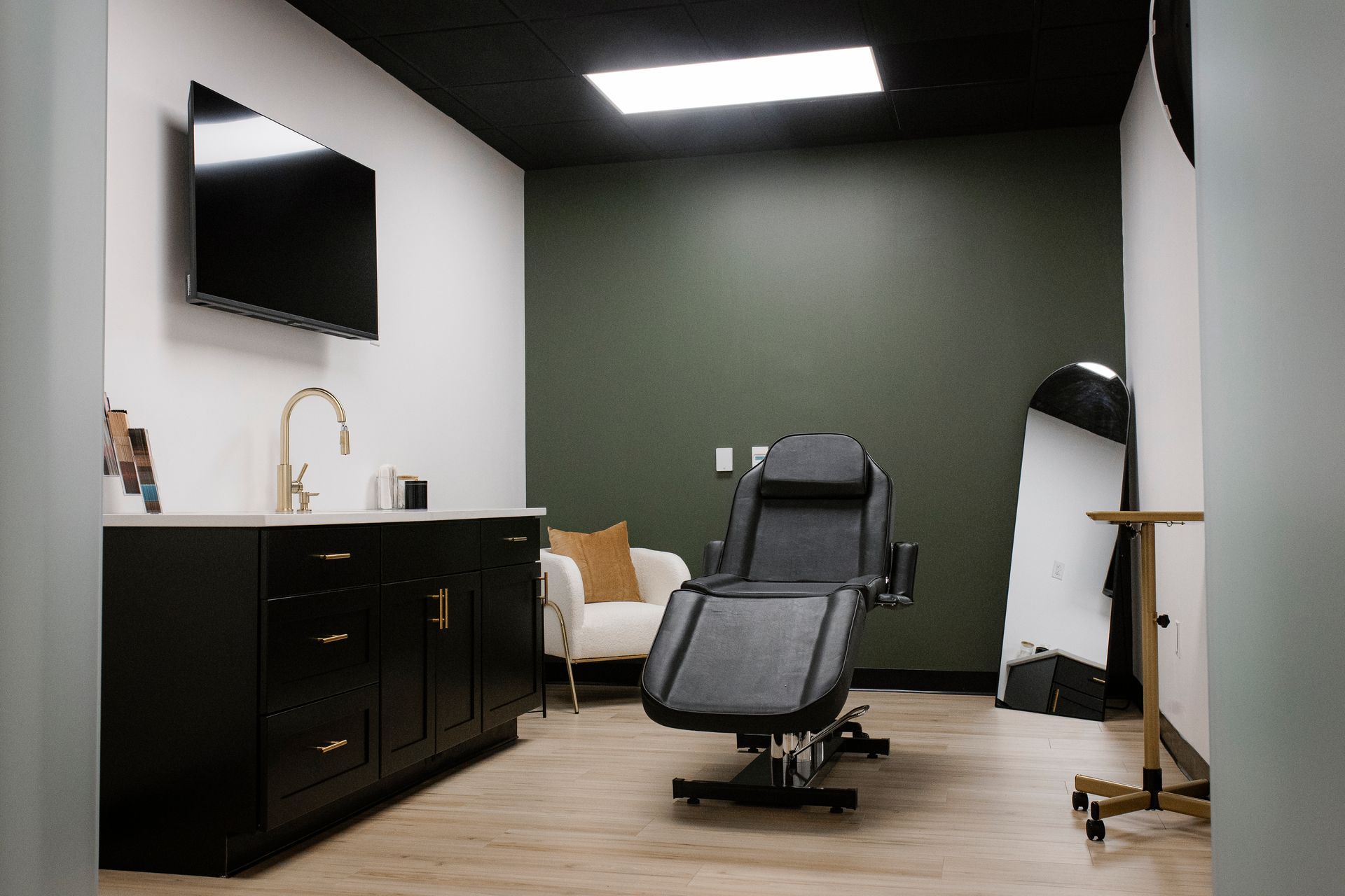 A group of women are posing for a picture in front of a tree.