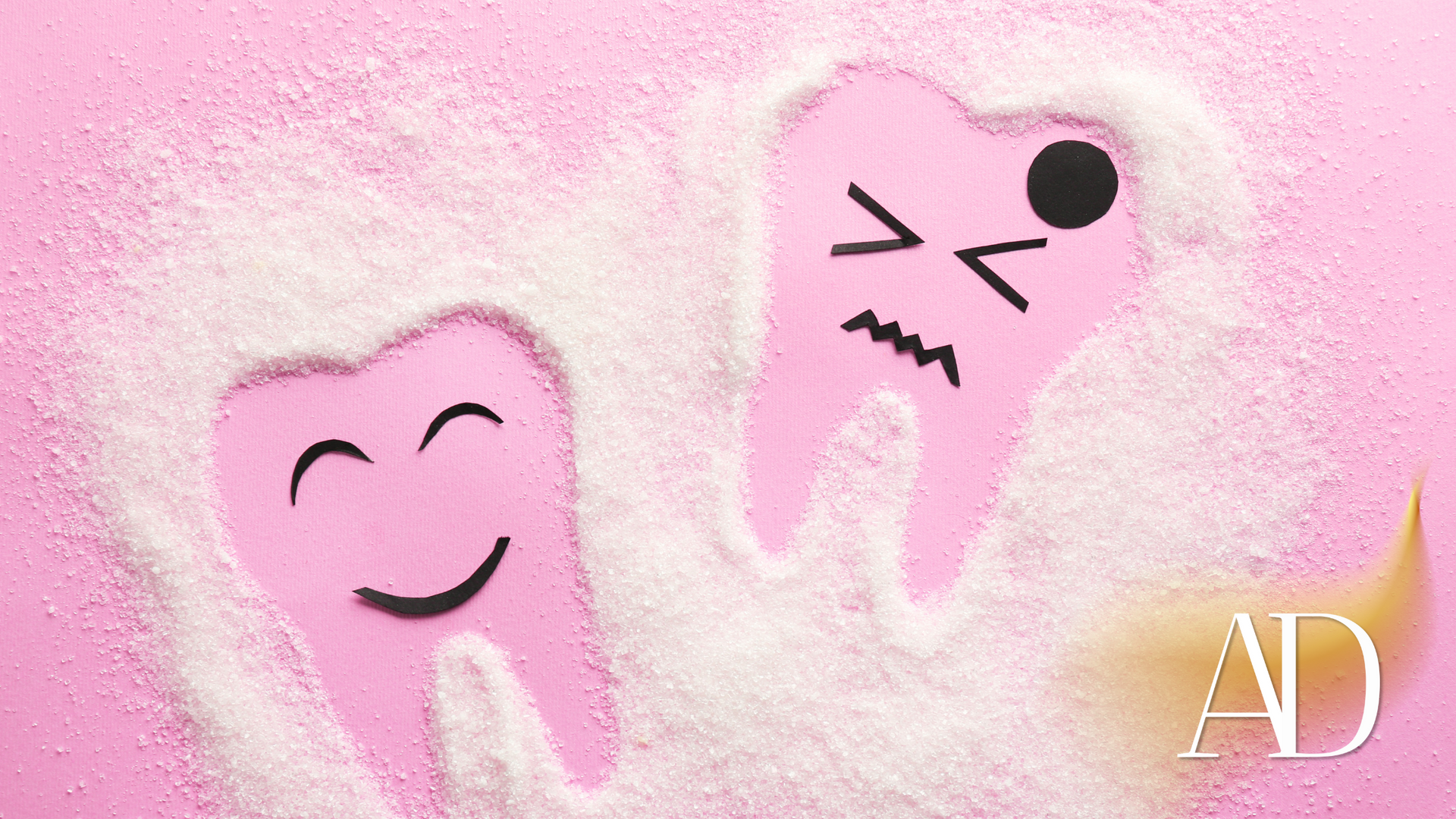 Two pink teeth with smiley faces drawn on them on a pink background.