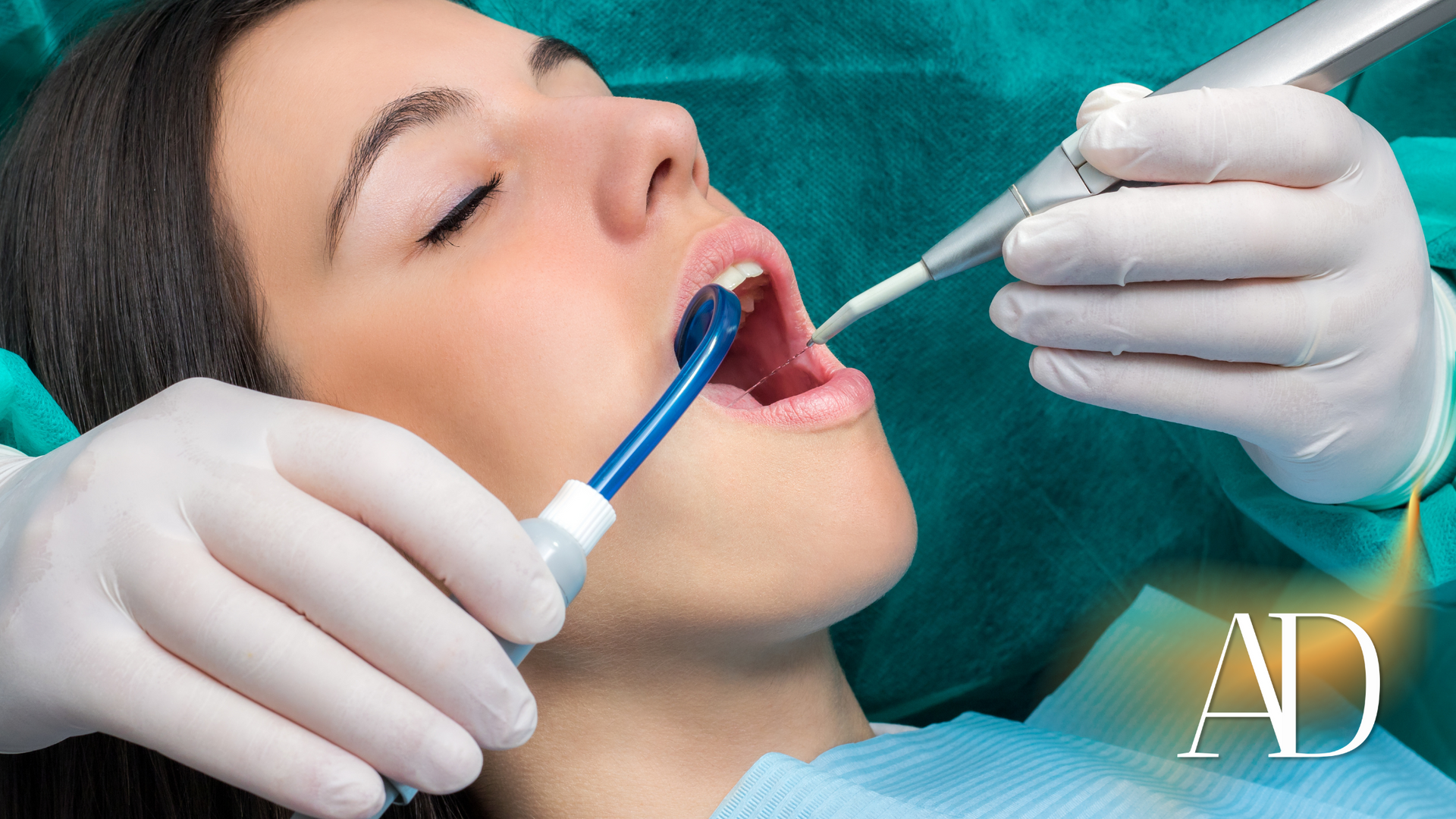 A woman is getting her teeth examined by a dentist.