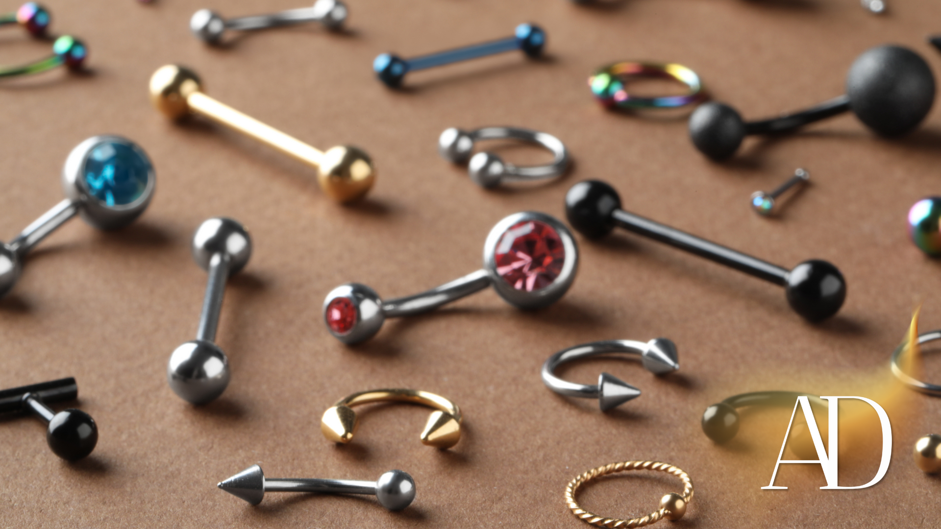 A bunch of different types of piercings on a table