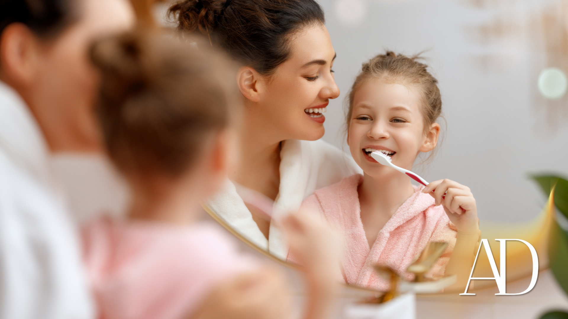 A family is brushing their teeth together in front of a mirror.