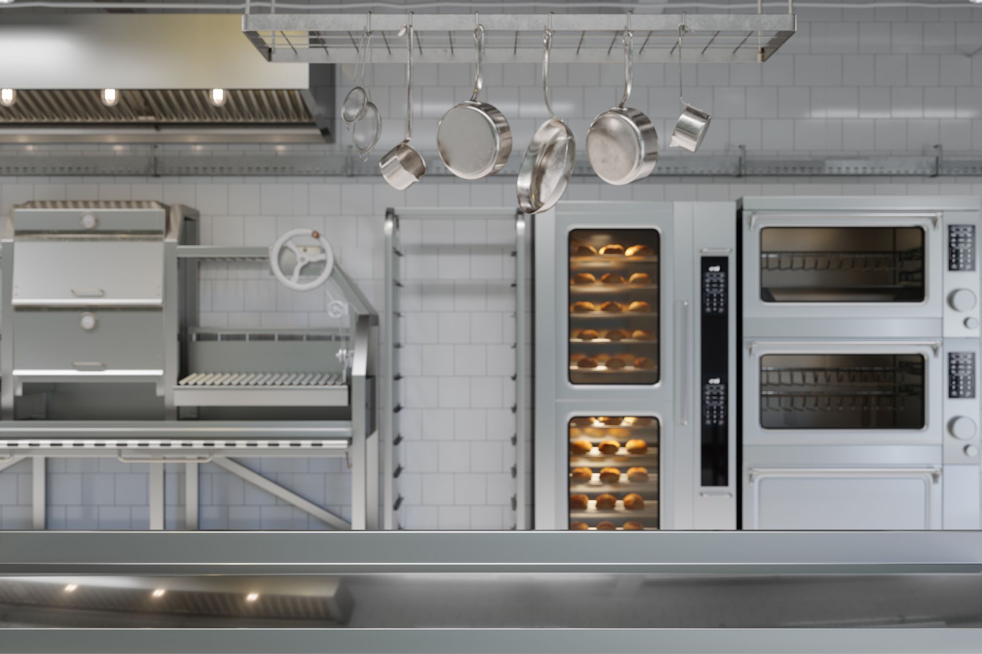 Kitchen with kitchen utensils, food service equipment, and bakery products.