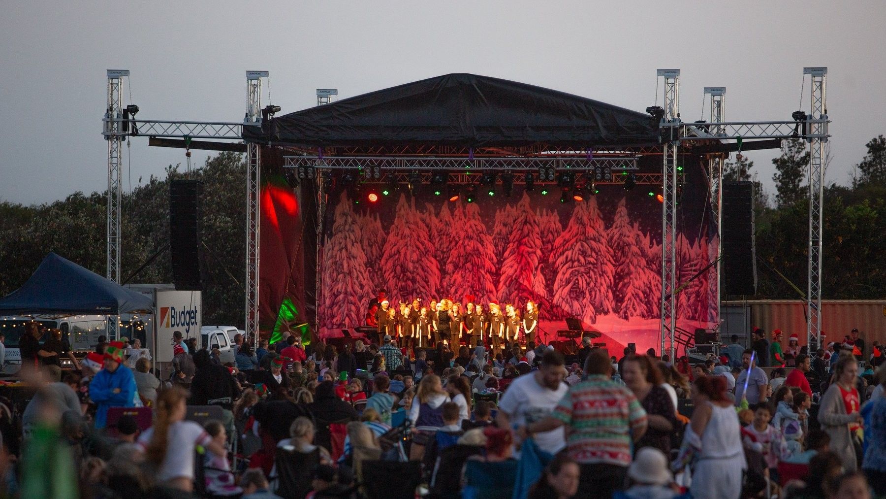 Four pieces of black carpet are stacked on top of each other on a white background.