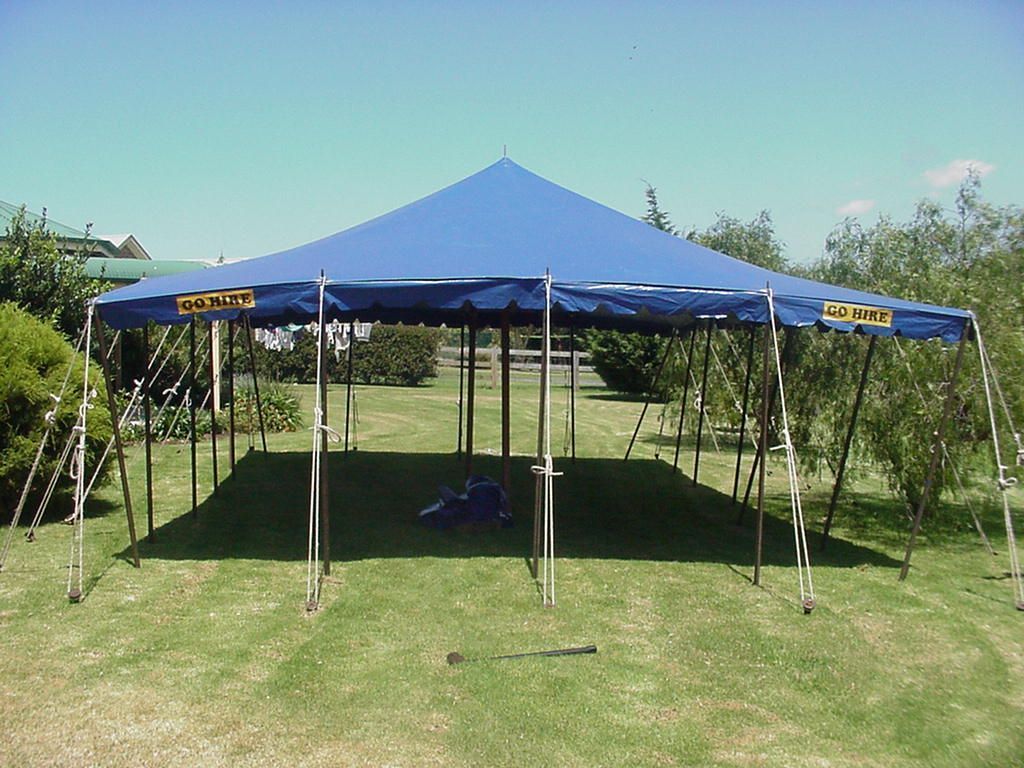 A blue tent with a yellow sticker that says ' large ' on it