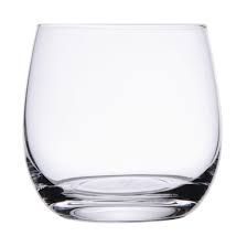 A clear glass is sitting on a white surface.