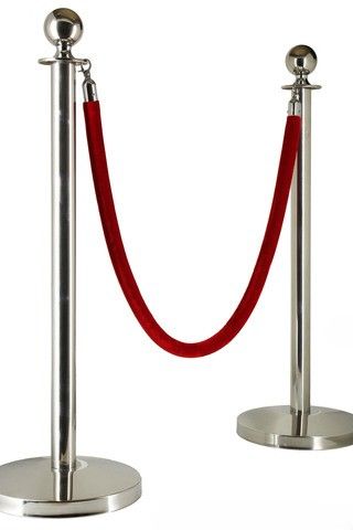 A silver pole with a red rope attached to it