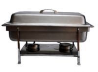 A stainless steel chafing dish is sitting on top of a stove.