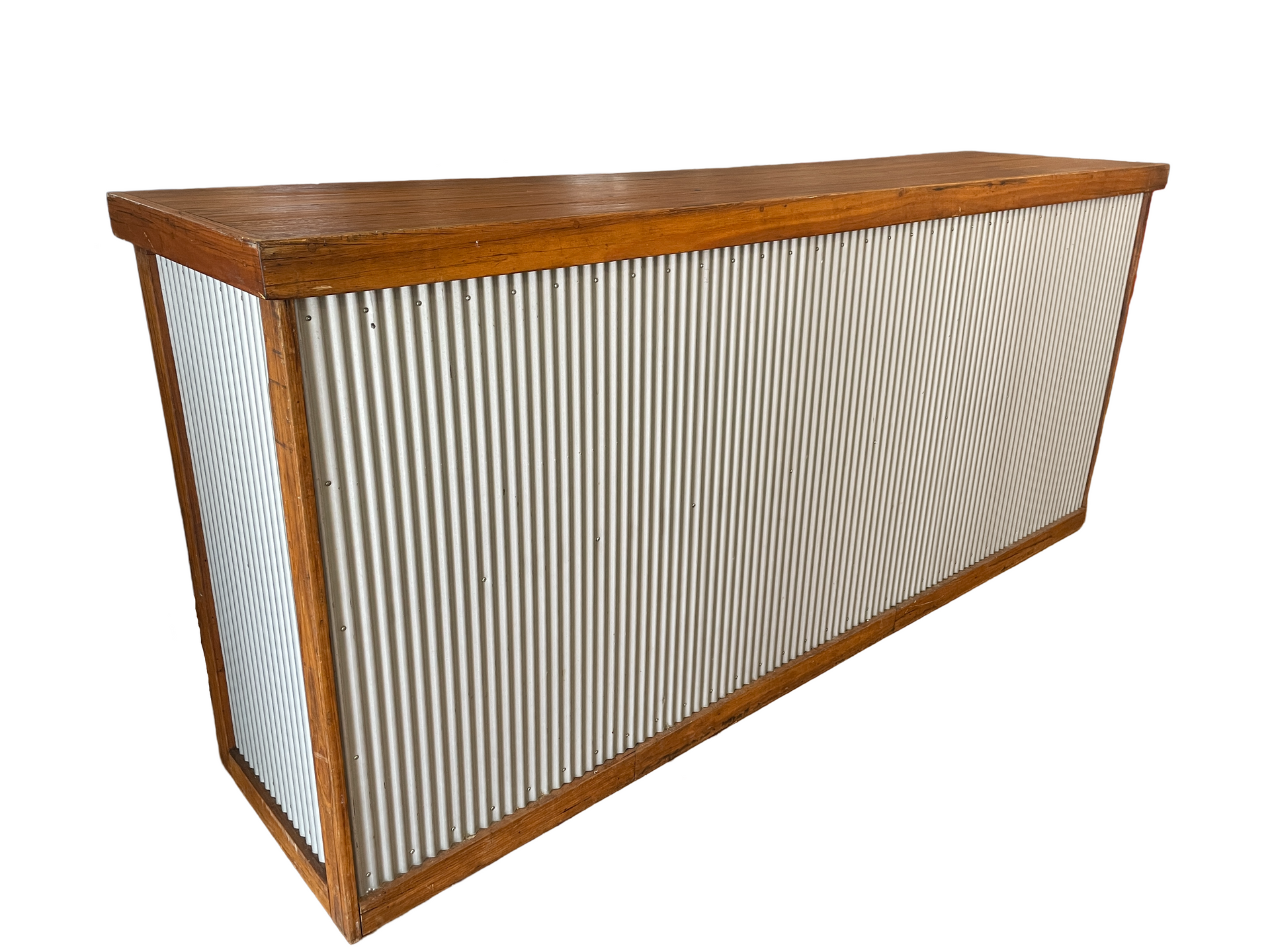 A long wooden bar with a corrugated metal top on a white background.