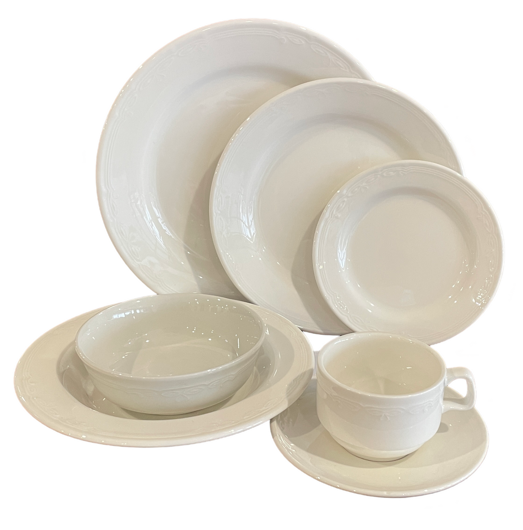 A set of white plates bowls and cups on a white background
