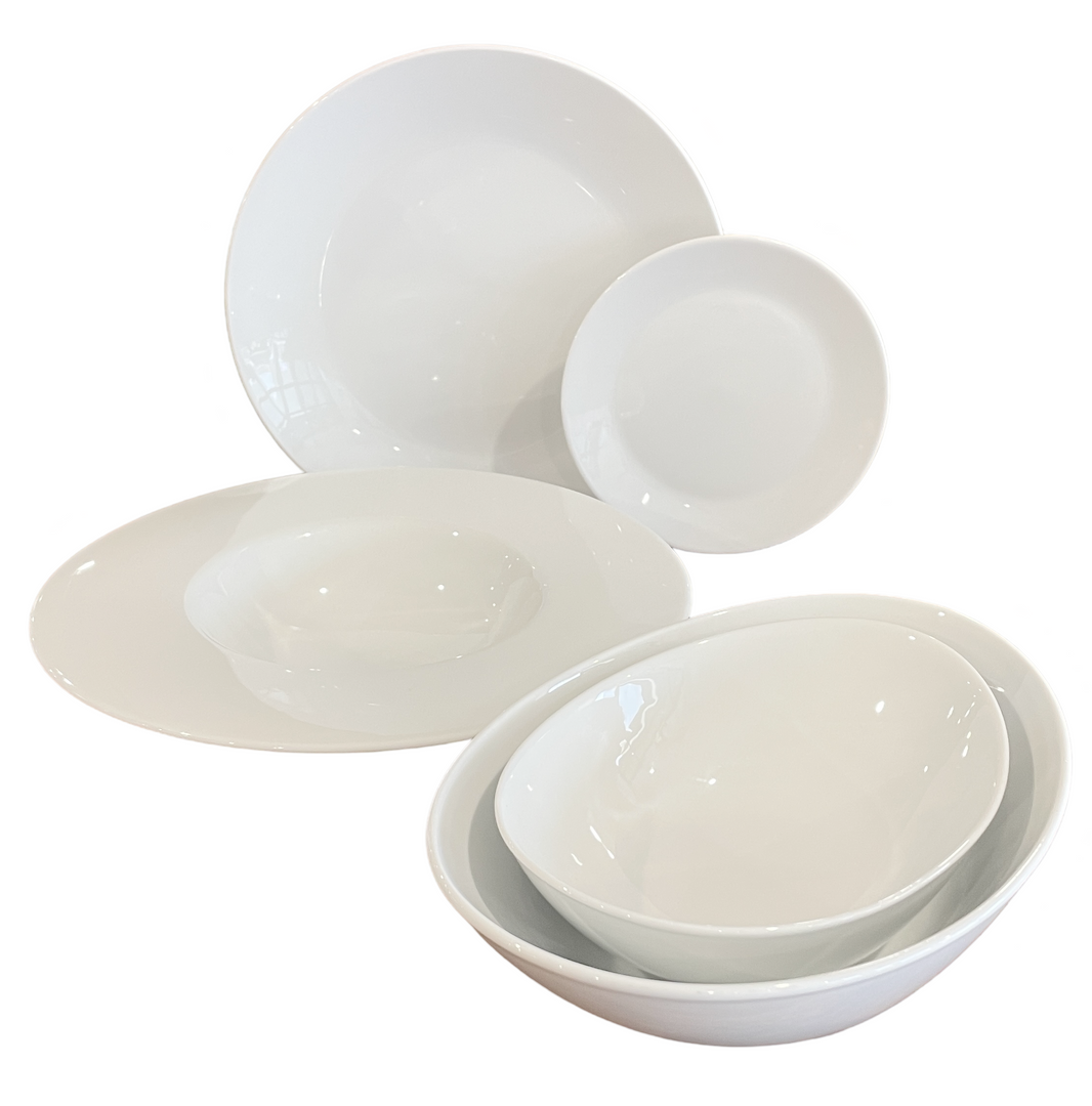 A group of white plates and bowls on a white background