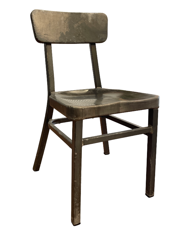 A wooden chair is sitting on a white surface.