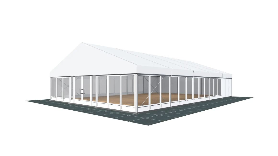 A large white tent with a lot of windows and a wooden floor.