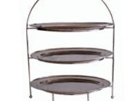 A three tiered tray stand with three plates on it.