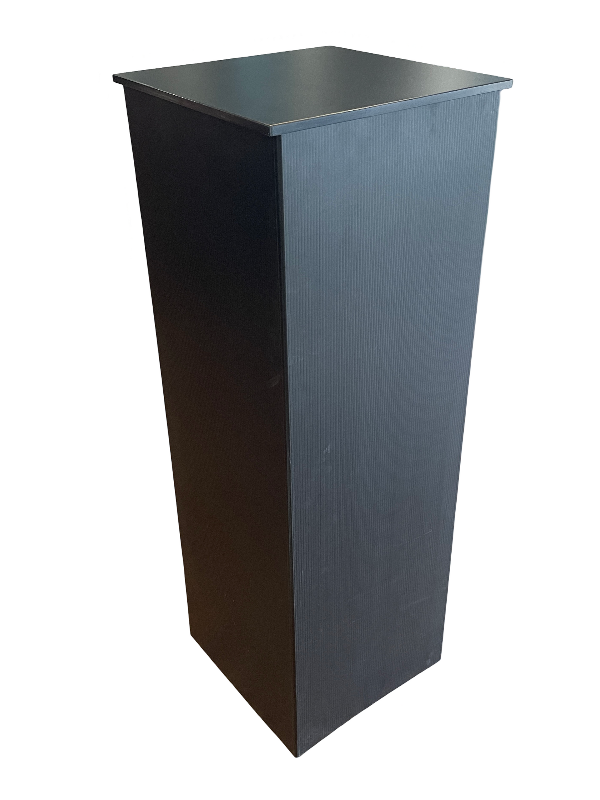 A black box with a white background is sitting on a table.