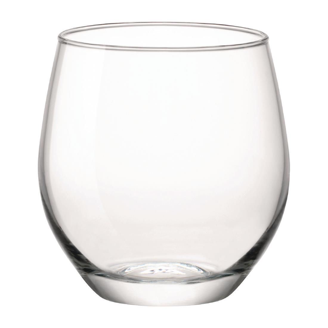 A clear glass is sitting on a white surface.