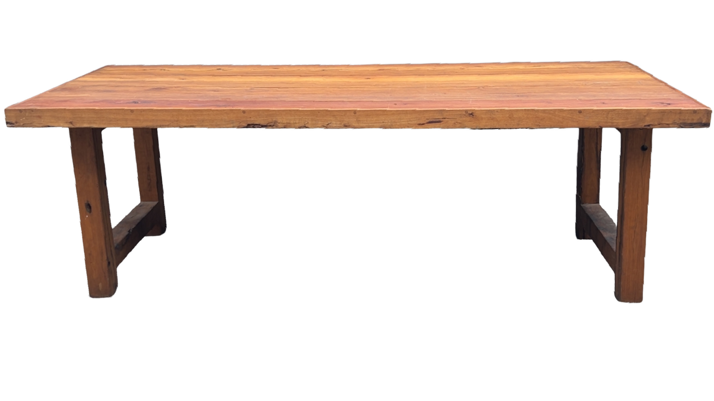 A long wooden table with a white background