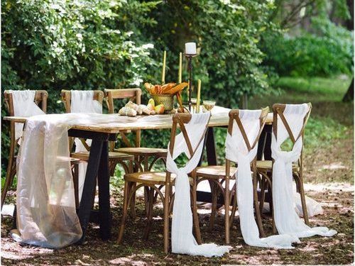 A table with chairs and a sign that says `` mr. and mrs. ''