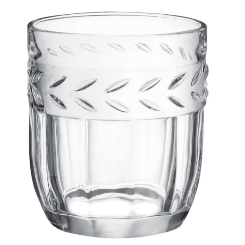 A clear glass with a leaf design on it