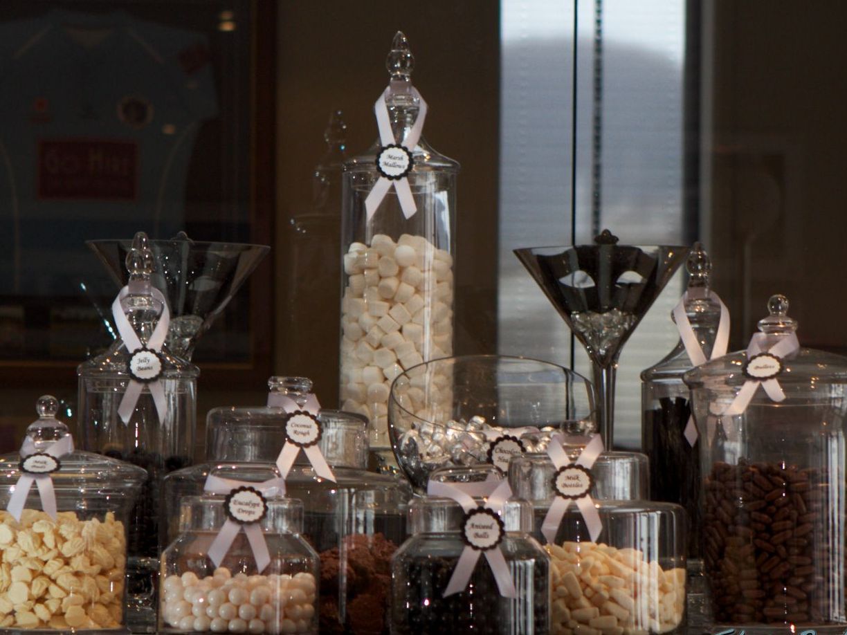 A display of jars filled with different types of food