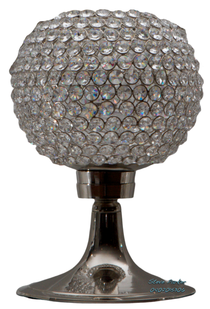 A lamp with a ball of crystals on top of it.