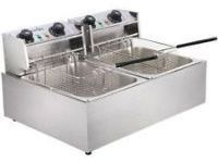 A stainless steel deep fryer with two baskets and a frying pan.