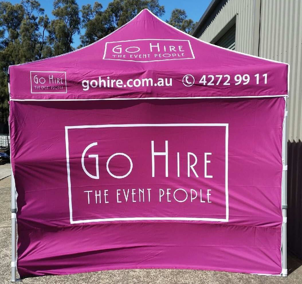A purple tent with the words go hire the event people on it