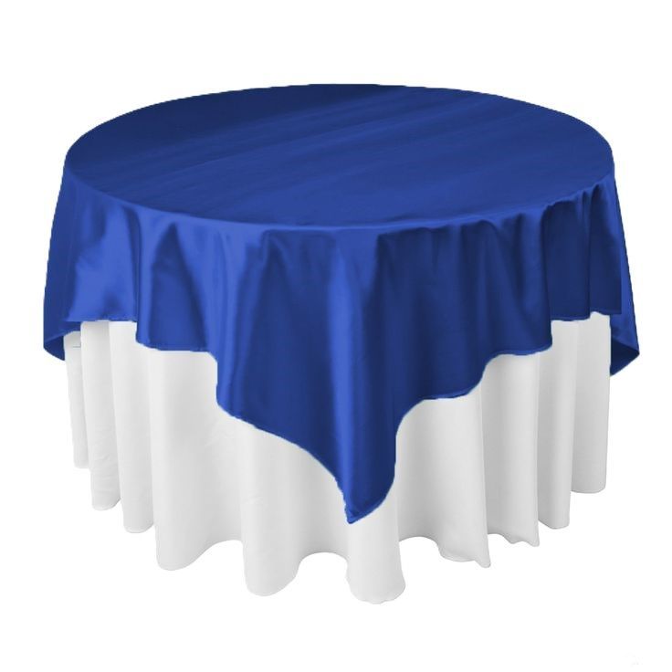 A round table with a blue table cloth and a white table cloth