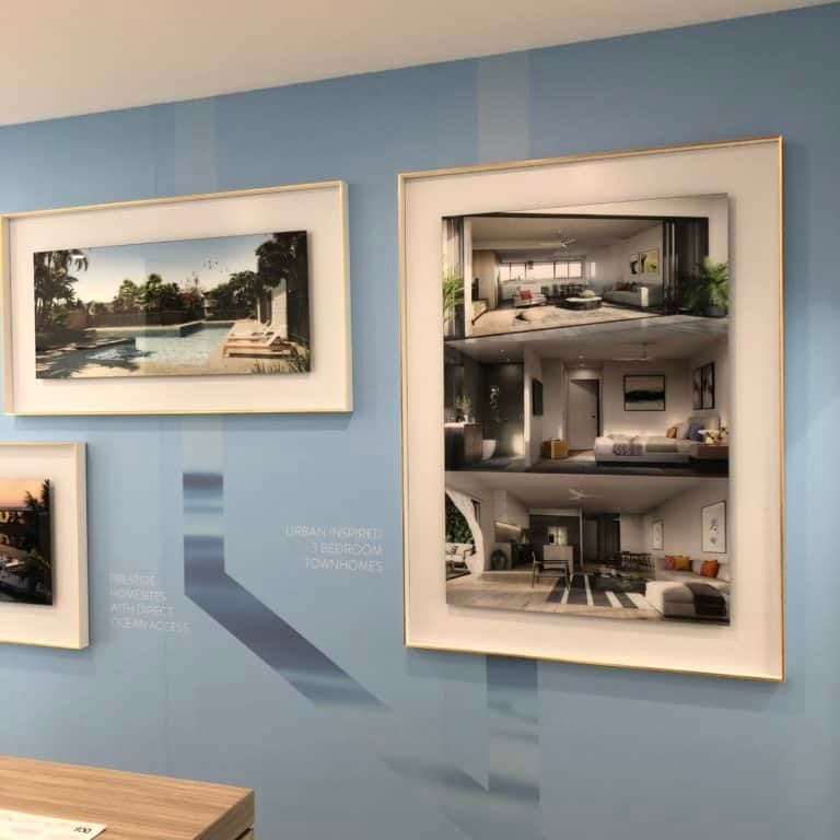A Blue Wall With Three Framed Pictures on It — Gold Coast Printing & Framing in Burleigh Heads, QLD