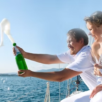A man is opening a bottle of champagne on a boat