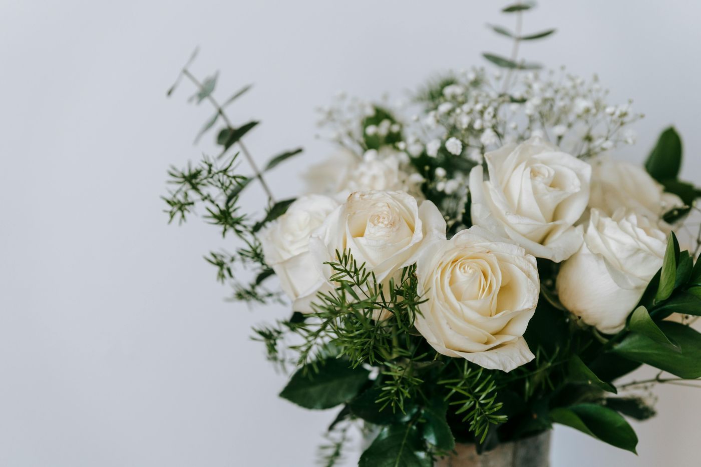 A close up of a bouquet of flowers on a table