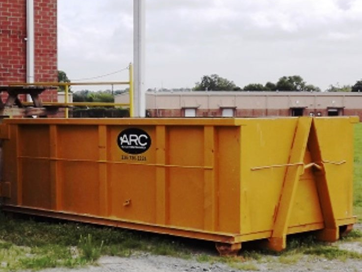 yellow commercial dumpster