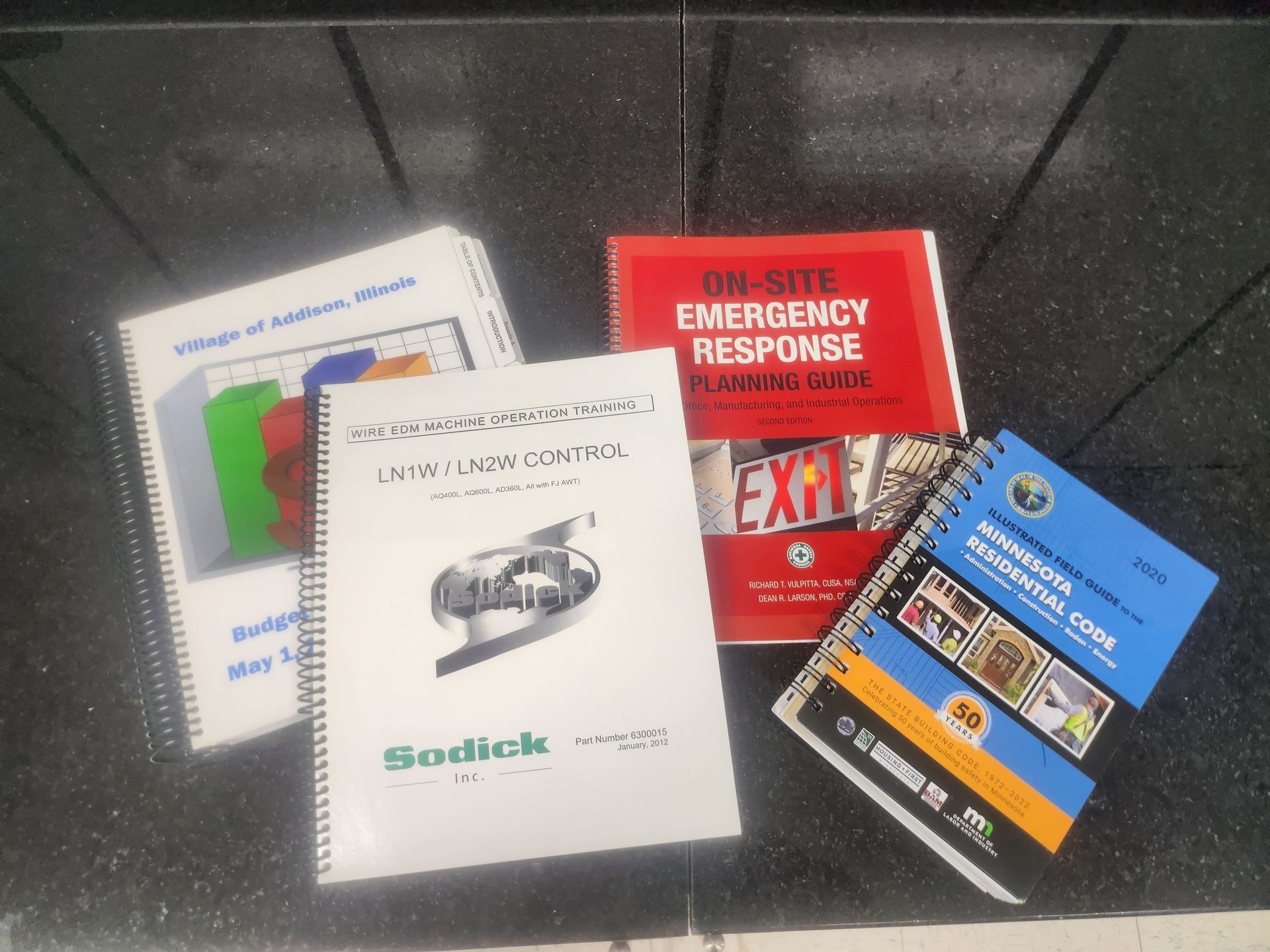 A spiral bound book titled on-site emergency response
