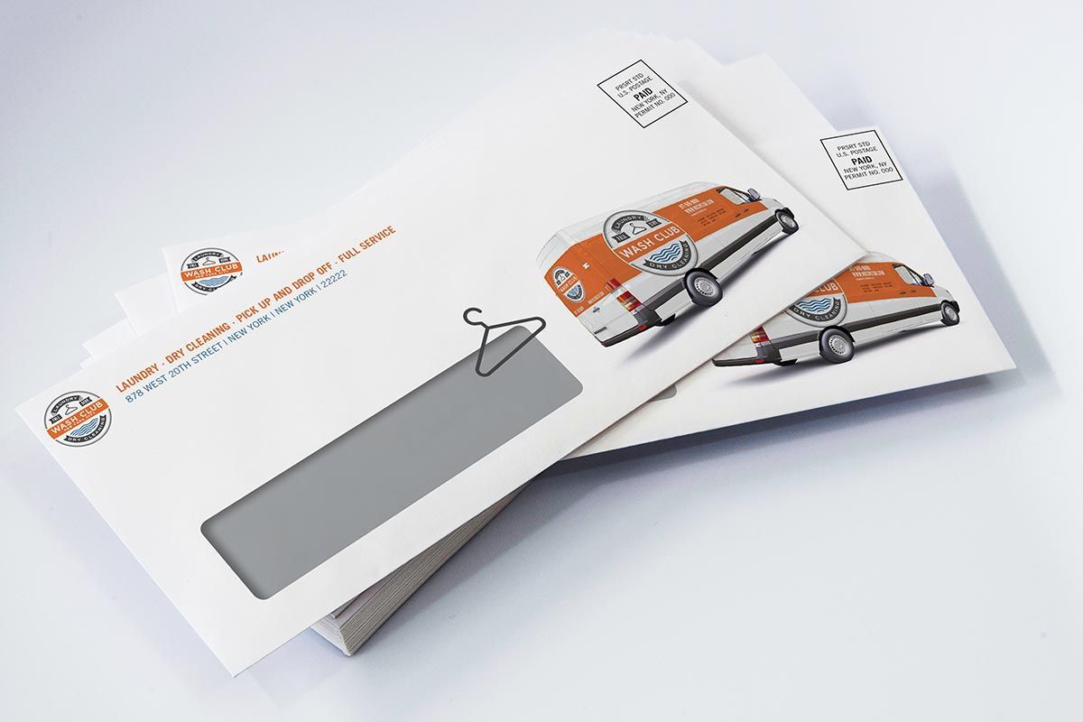 A stack of envelopes with a picture of a car on them