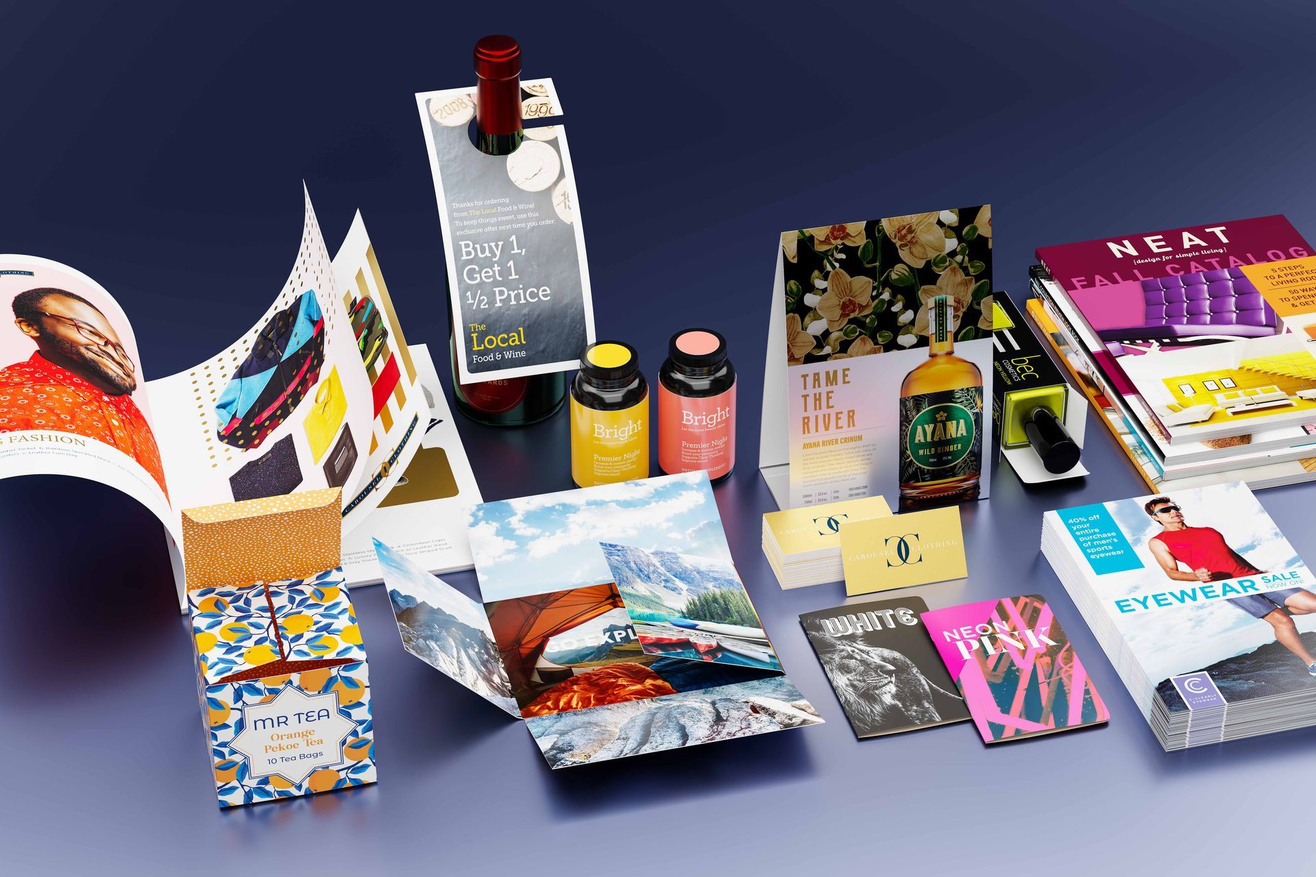 A table topped with a variety of brochures and magazines.