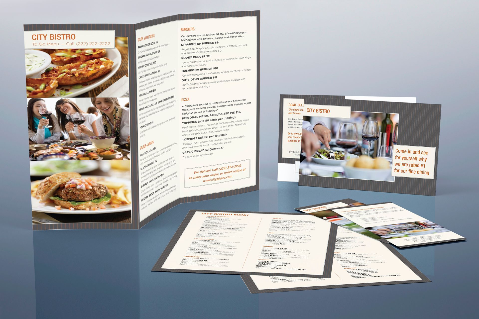 A group of menus are sitting on top of each other on a table.