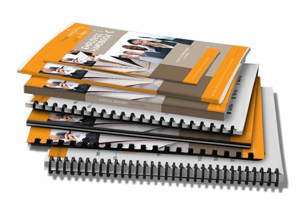 A stack of spiral bound books on a white background