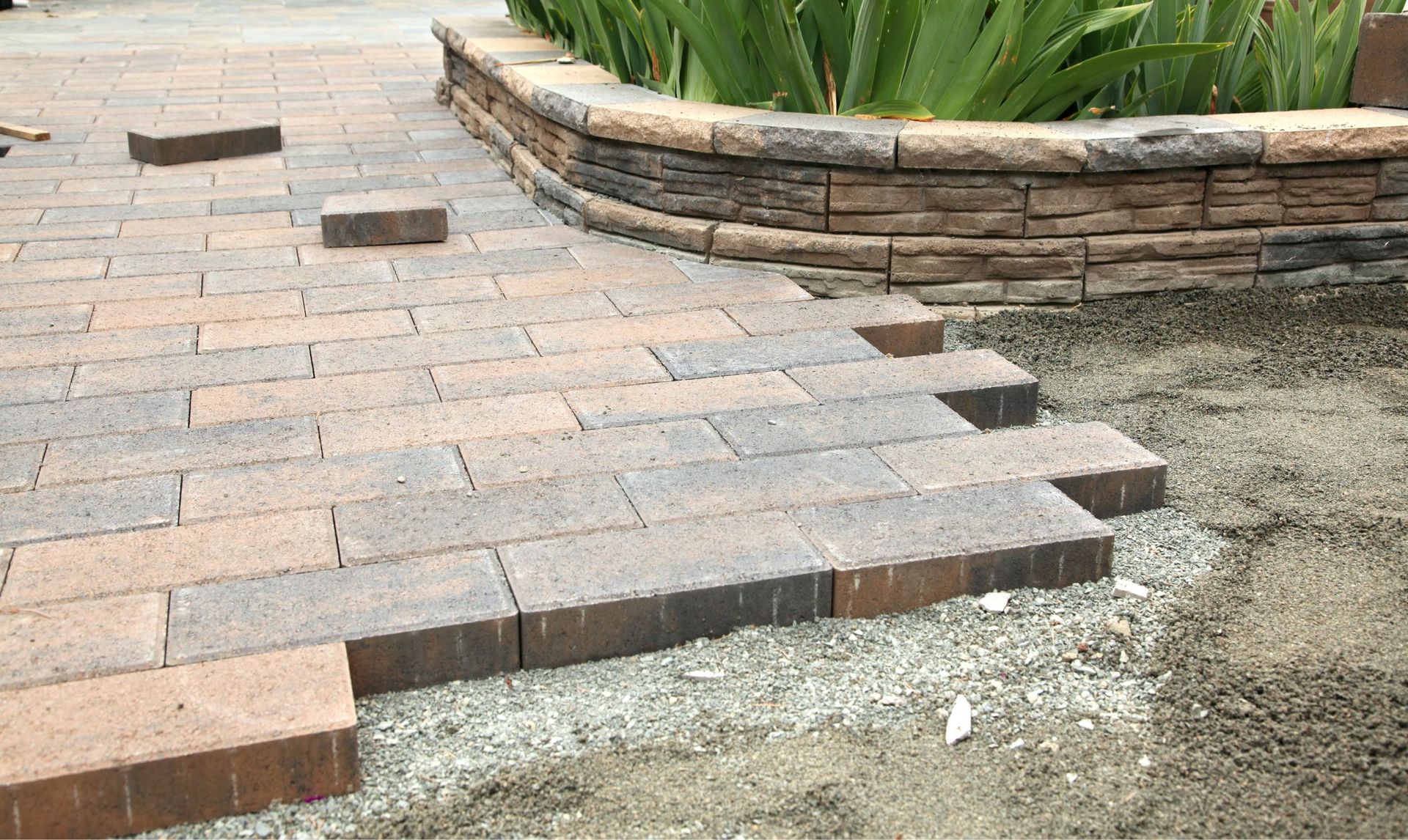 Brick pavers being installed on a pathway.
