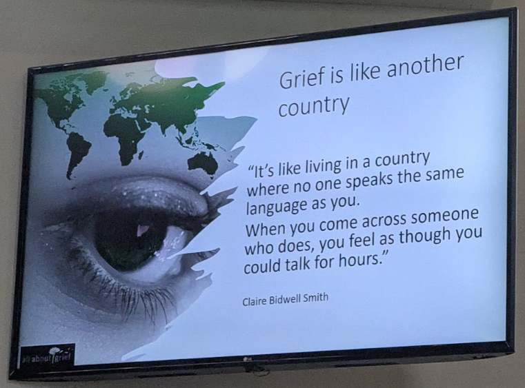 Slide at seminar with a quote by Claire Bidwell Smith about feeling like no-one understands when you are experiencing grief.