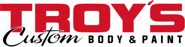 Red "TROY'S" text with "Custom BODY & PAINT" below in black, logo for a body shop.
